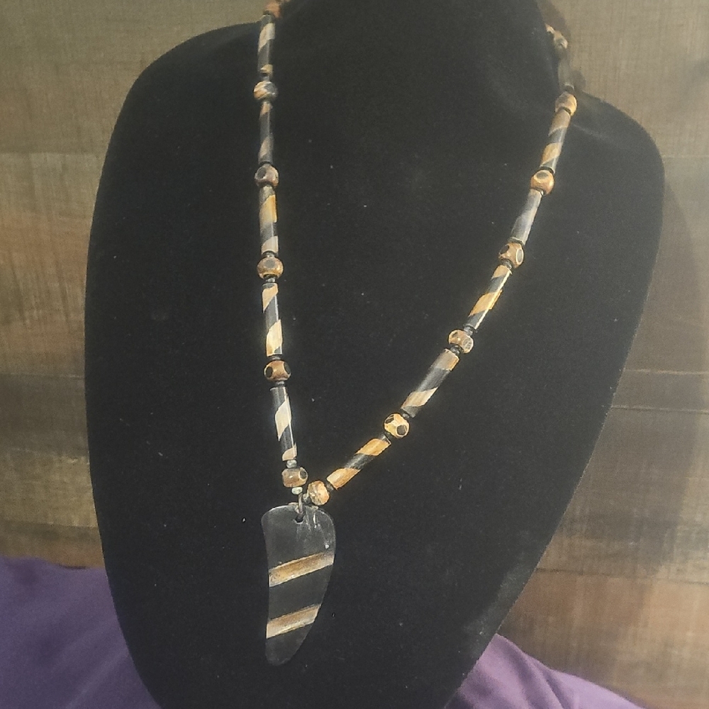 Black and Gold Beaded Necklace with Striped Pendant